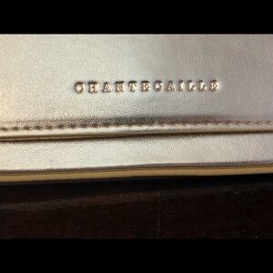 Gorgeous Chantecaille Gold clutch snap closing 4 1/2 X 8 inches. Unused